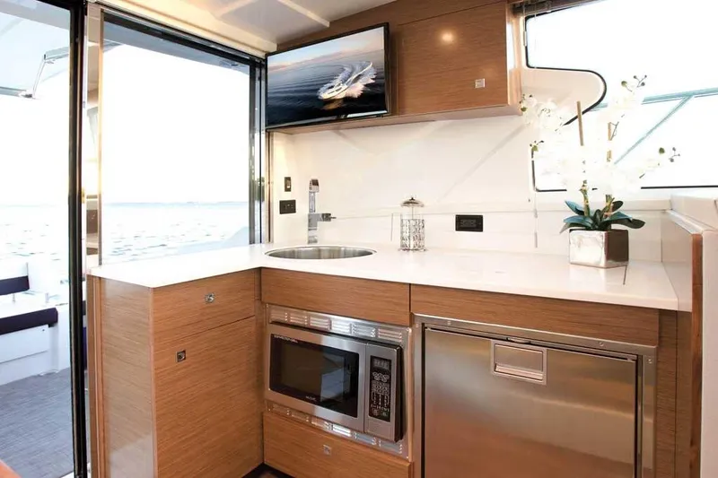 Slide: The Image of Modern kitchen interior of 2023 Cruisers 42 Cantius yacht with sleek appliances and elegant design. - 5