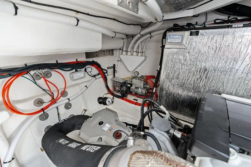 Slide: The Image of Engine room of 2023 Cruisers 42 Cantius yacht, showcasing wiring and mechanical components. - 50