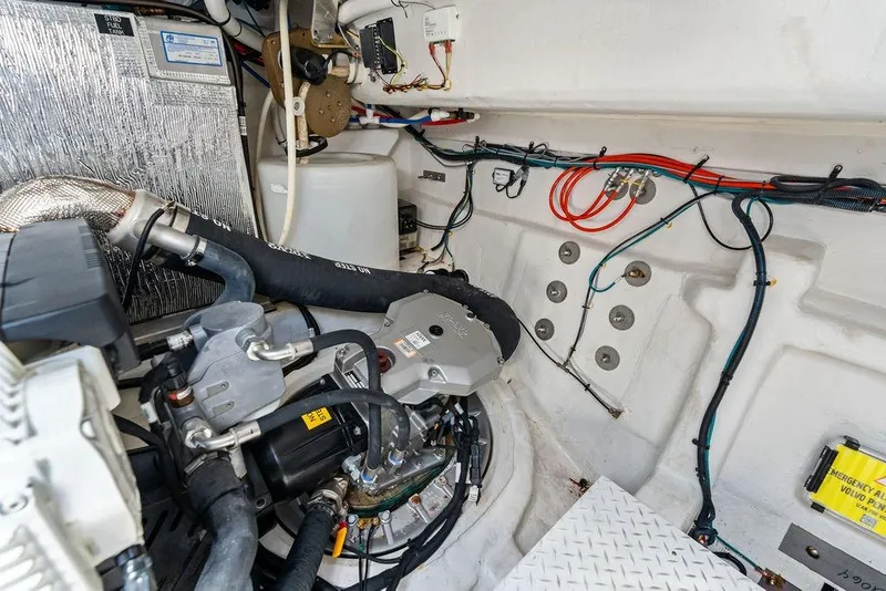Slide: The Image of Engine room of 2023 Cruisers 42 Cantius yacht, showcasing mechanical components and wiring. - 51