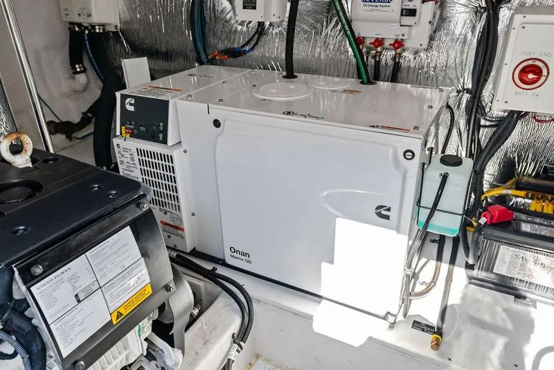 Slide: The Image of Engine room of 2023 Cruisers 42 Cantius yacht with Onan Marine generator. - 52