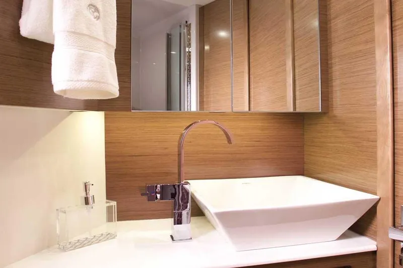 Slide: The Image of Luxurious bathroom in 2023 Cruisers 42 Cantius yacht with modern sink and wooden accents. - 8