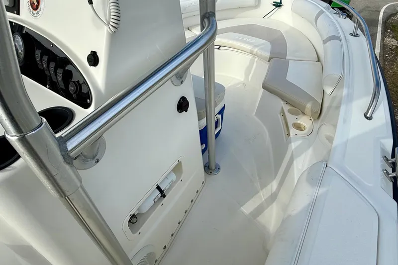 Slide: The Image of 2008 Boston Whaler 210 Outrage boat interior with seating and console details. - 13
