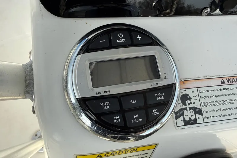 Slide: The Image of Control panel of a 2008 Boston Whaler 210 Outrage boat with warning labels. - 17