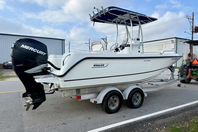 Slide: The Image of 2008 Boston Whaler 210 Outrage boat on trailer with Mercury engine. - 4