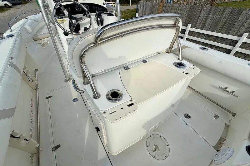 Slide: The Image of 2008 Boston Whaler 210 Outrage boat interior with steering console and seating area. - 8