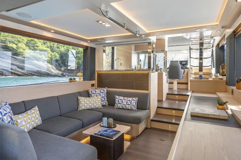 Slide: The Image of Manufacturer Provided Image: Luxurious interior of 2026 Beneteau Swift Trawler 54 with modern seating and scenic views. - 5
