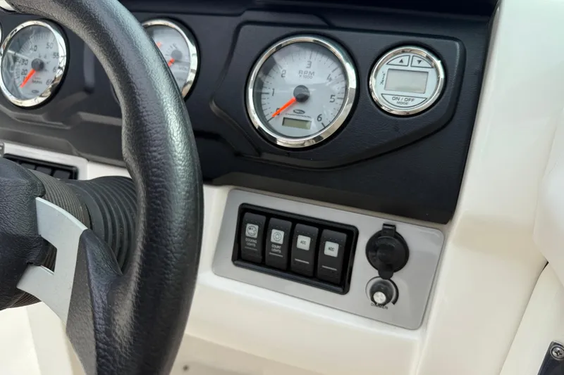 Slide: The Image of Dashboard of 2011 Chaparral 216 SSi Wide Tech boat with gauges and controls. - 15