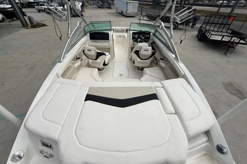 Slide: The Image of 2011 Chaparral 216 SSi Wide Tech boat interior with seating and steering console. - 7
