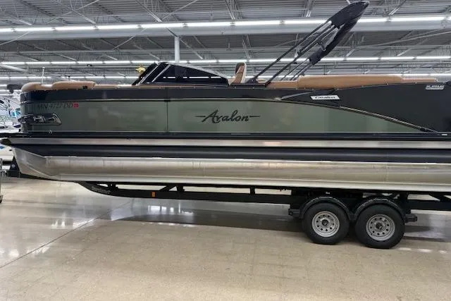 The Image of 2023 Avalon Catalina 2585 QL pontoon boat on trailer in showroom. - 1