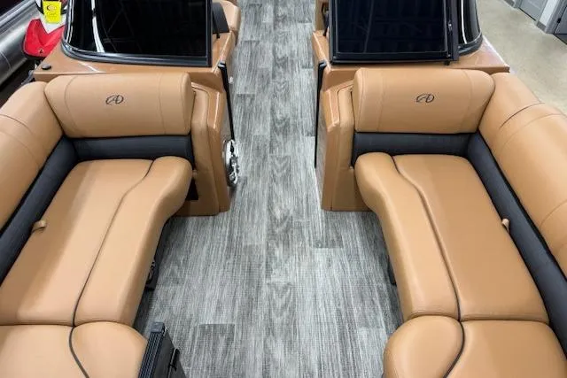 Slide: The Image of Luxurious interior of 2023 Avalon Catalina 2585 QL with tan leather seating and wood-style flooring. - 15