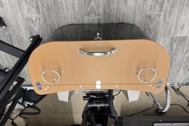 Slide: The Image of 2023 Avalon Catalina 2585 QL boat dashboard with cup holders and handle. - 18