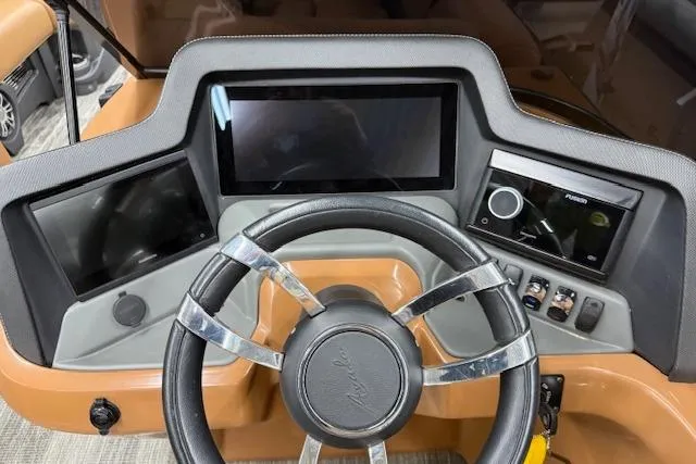 Slide: The Image of Steering console of 2023 Avalon Catalina 2585 QL with modern controls and displays. - 27