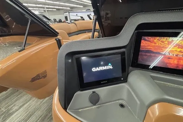 Slide: The Image of 2023 Avalon Catalina 2585 QL boat dashboard with Garmin navigation display. - 32