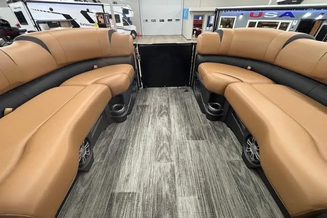 Slide: The Image of 2023 Avalon Catalina 2585 QL interior with tan seating and wood-style flooring. - 37