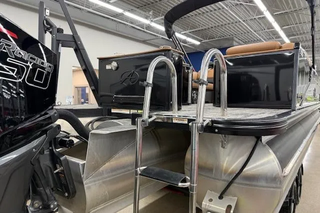 Slide: The Image of 2023 Avalon Catalina 2585 QL pontoon boat with ladder and engine in showroom. - 5