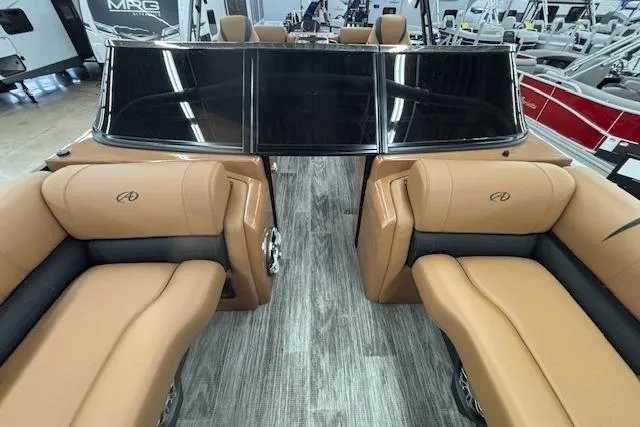 Slide: The Image of 2023 Avalon Catalina 2585 QL boat interior with tan seating and sleek design. - 8