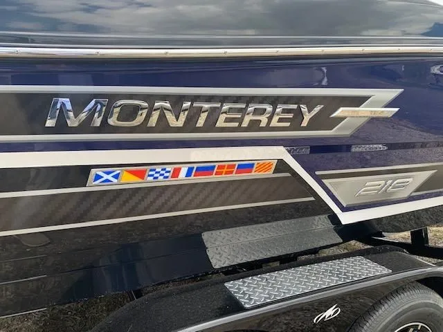 Slide: The Image of Monterey 218 Super Sport boat, 2021 model, with flag decals. - 13