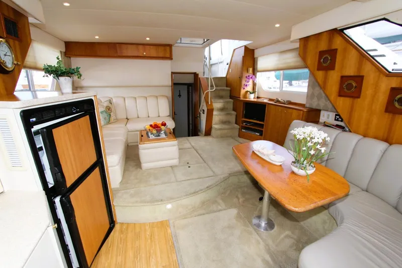 Slide: The Image of Luxurious interior of 1998 Silverton 372 Motor Yacht with elegant seating and decor. - 11