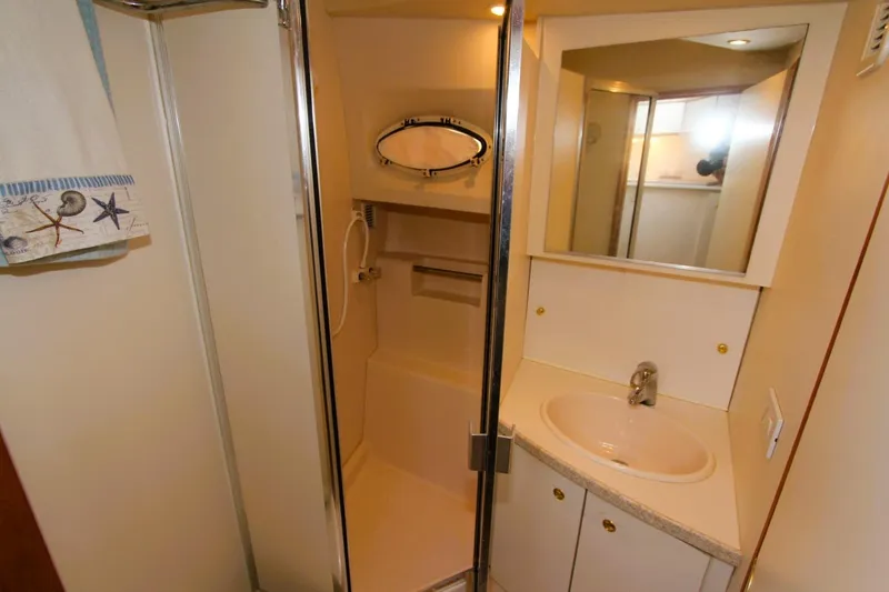 Slide: The Image of Bathroom interior of 1998 Silverton 372 Motor Yacht with shower and sink. - 16