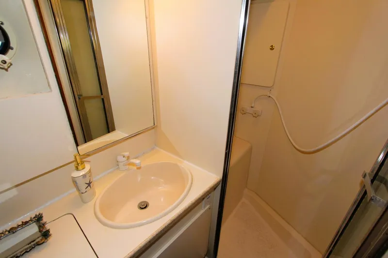 Slide: The Image of Bathroom interior of 1998 Silverton 372 Motor Yacht with sink and shower. - 22