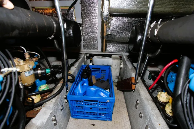 Slide: The Image of Engine room of 1998 Silverton 372 Motor Yacht with maintenance supplies. - 36