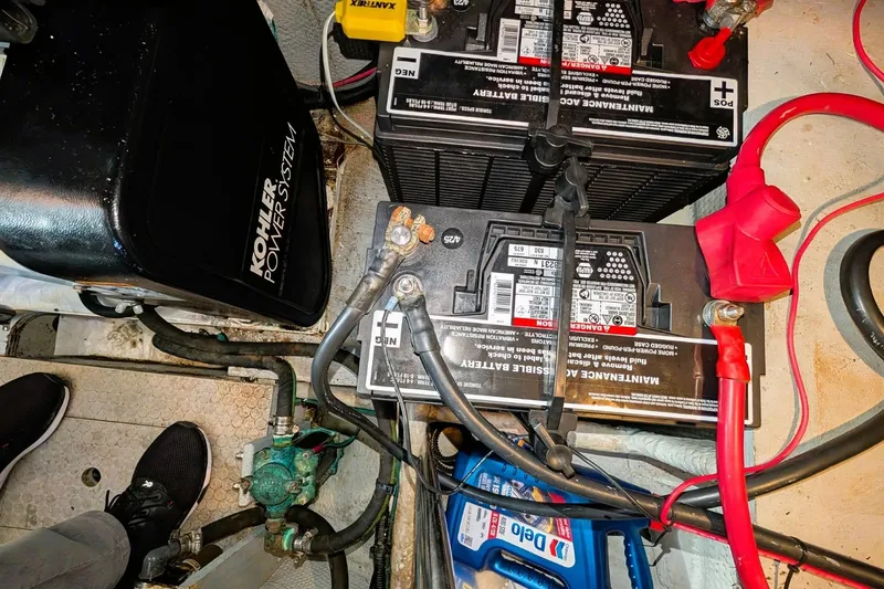 Slide: The Image of Engine room of 1998 Silverton 372 Motor Yacht with batteries and Kohler power system. - 41