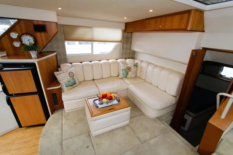 Slide: The Image of Luxurious interior of 1998 Silverton 372 Motor Yacht with plush seating and elegant decor. - 6
