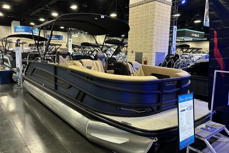 The Image of 2026 Evotti 723CS pontoon boat displayed at an indoor boat show. - 1