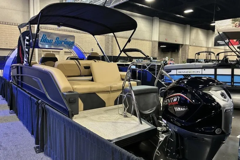 Slide: The Image of 2026 Evotti 723CS boat with Yamaha engine displayed at indoor boat show. - 10