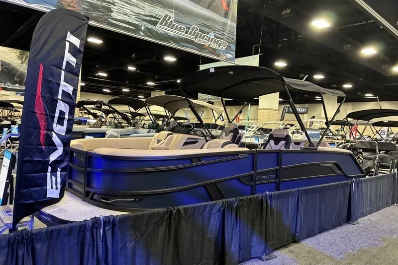 Slide: The Image of 2026 Evotti 723CS luxury boat displayed at an indoor boat show. - 7