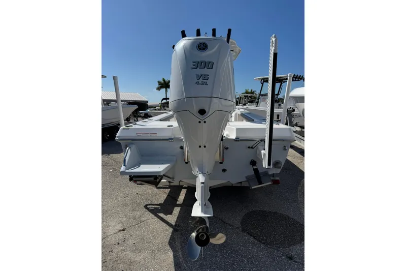 Slide: The Image of 2024 Everglades 243 Center Console boat with powerful 300 V6 engine, rear view. - 3