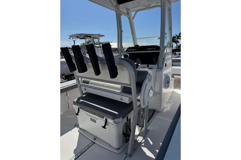Slide: The Image of 2024 Everglades 243 Center Console boat interior with rod holders and Yeti cooler. - 5