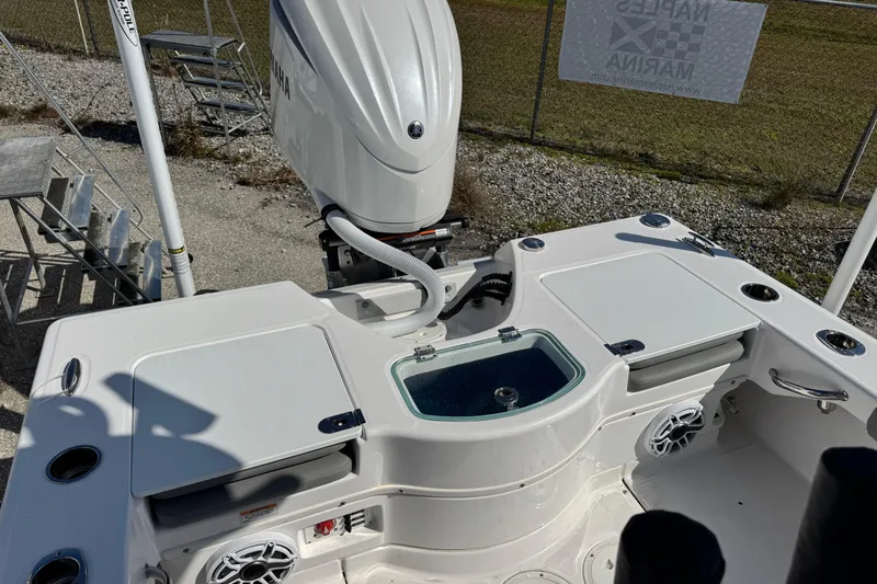 Slide: The Image of 2024 Everglades 243 Center Console boat with Yamaha engine, featuring a sleek deck design. - 6