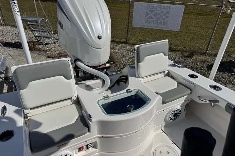 Slide: The Image of 2024 Everglades 243 Center Console boat with Yamaha engine and seating area. - 7
