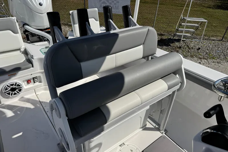 Slide: The Image of 2024 Everglades 243 Center Console boat interior with seating and controls. - 8