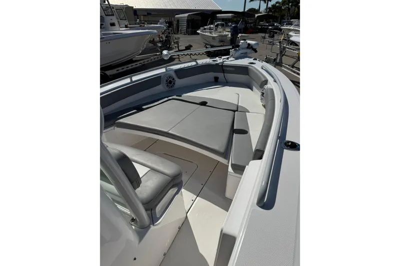 Slide: The Image of 2024 Everglades 243 Center Console boat interior with seating and storage. - 9