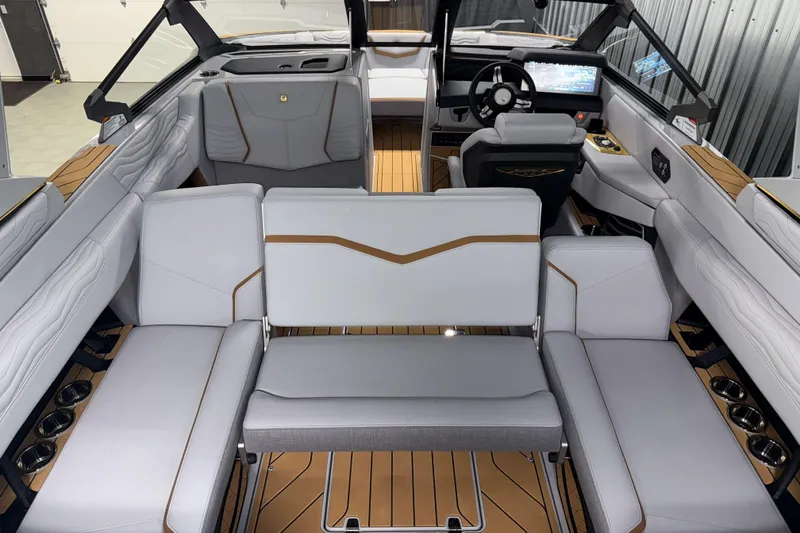Slide: The Image of 2026 Nautique Super Air Nautique G23 interior with luxurious seating and modern dashboard. - 12