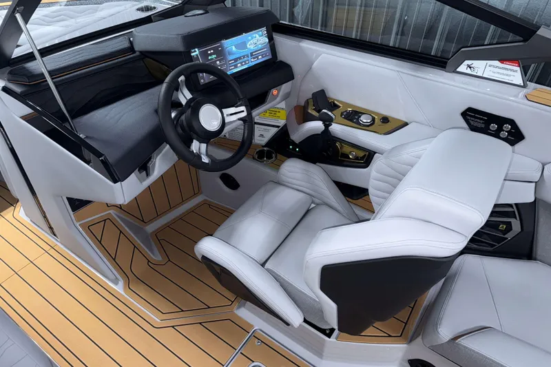 Slide: The Image of 2026 Nautique Super Air Nautique G23 cockpit with modern controls and luxurious seating. - 14