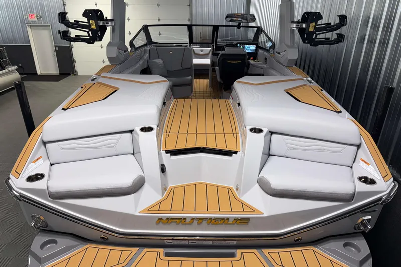 Slide: The Image of 2026 Nautique Super Air Nautique G23 boat interior with sleek seating and modern design. - 2