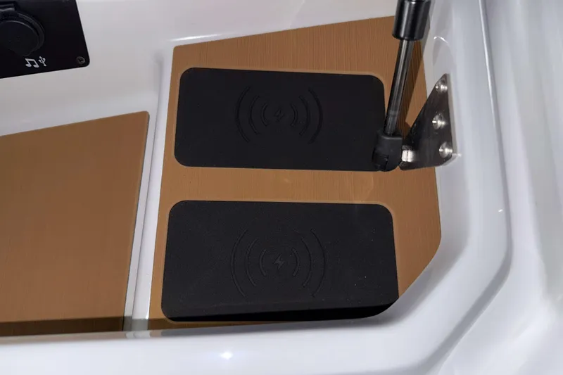 Slide: The Image of 2026 Nautique Super Air Nautique G23 wireless charging pads and USB port detail. - 27