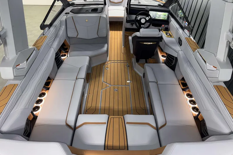 Slide: The Image of 2026 Nautique Super Air Nautique G23 interior with luxurious seating and modern dashboard. - 34