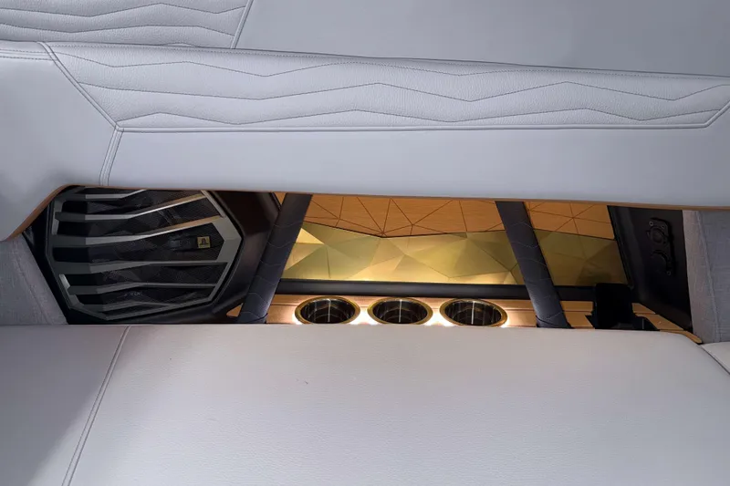 Slide: The Image of 2026 Nautique Super Air Nautique G23 interior with sleek design and cup holders. - 35