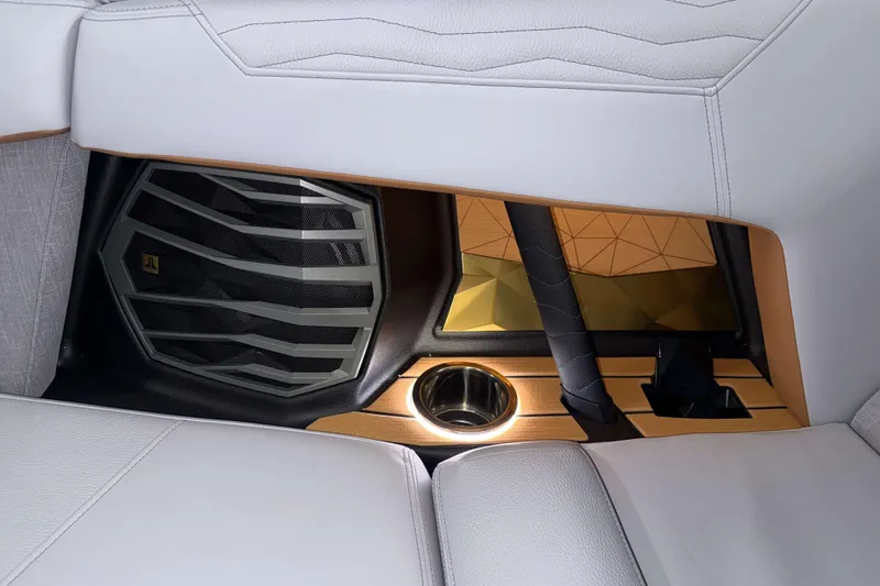 Slide: The Image of 2026 Nautique Super Air Nautique G23 interior detail with speaker and cup holder. - 36
