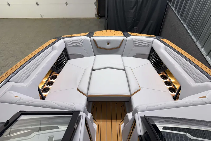 Slide: The Image of 2026 Nautique Super Air Nautique G23 boat interior with luxurious seating and cup holders. - 39