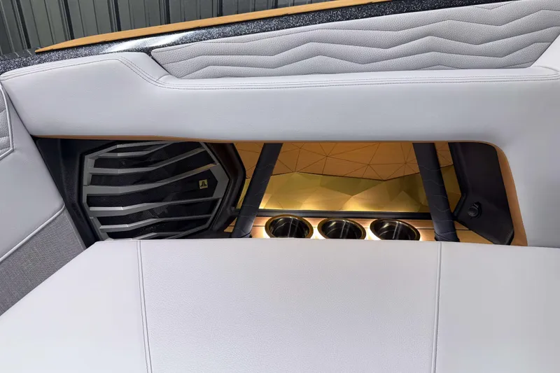 Slide: The Image of 2026 Nautique Super Air Nautique G23 interior with speaker and cup holders. - 41