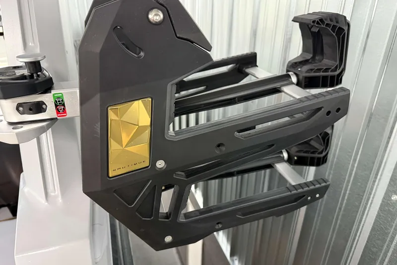 Slide: The Image of 2026 Nautique Super Air Nautique G23 wakeboard rack with sleek black and gold design. - 44