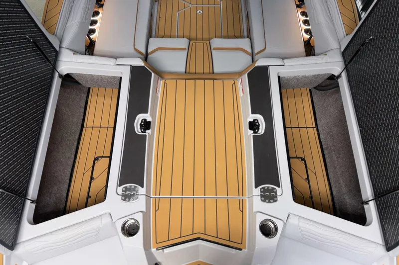 Slide: The Image of 2026 Nautique Super Air Nautique G23 interior with teak flooring and cushioned seating. - 45