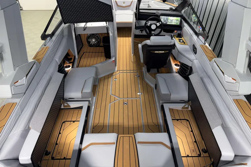 Slide: The Image of 2026 Nautique Super Air Nautique G23 interior with luxurious seating and advanced dashboard. - 46