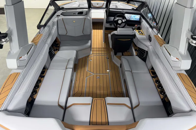 Slide: The Image of 2026 Nautique Super Air Nautique G23 interior with luxurious seating and advanced dashboard. - 5