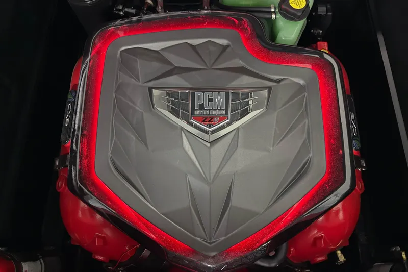 Slide: The Image of 2026 Nautique Super Air Nautique G23 engine with PCM cover and red accents. - 58